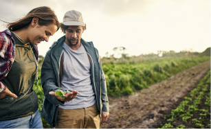 Two people looking at a crops in their hands